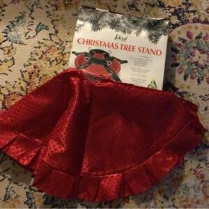Red Christmas tree skirt and tree stand.34 inch shiny red skirt and heavy steel